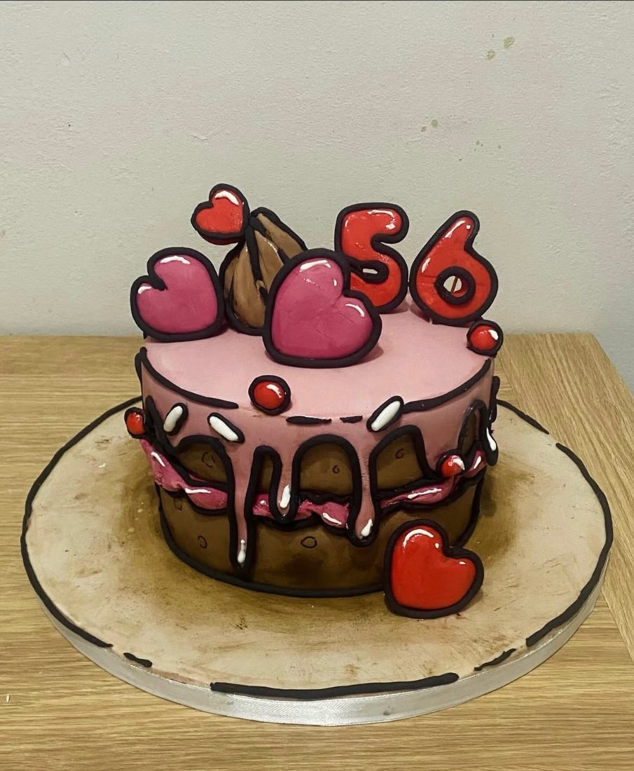 Comic-style pink and chocolate cake with outlined hearts