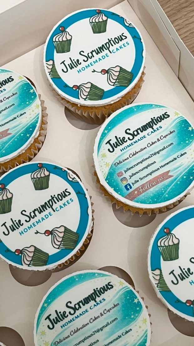 Box of cupcakes topped with Julie Scrumptious edible print discs