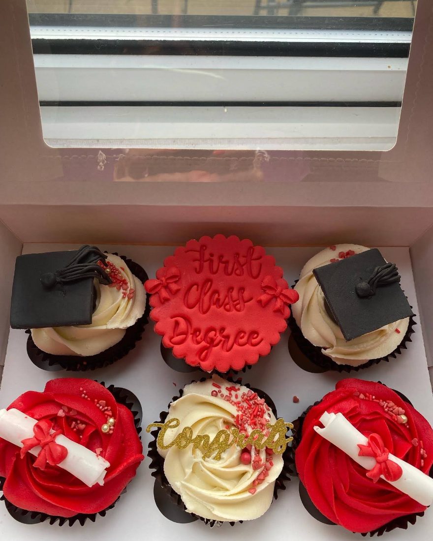 Graduation cupcakes with mortar boards, scrolls and a First Class Degree topper