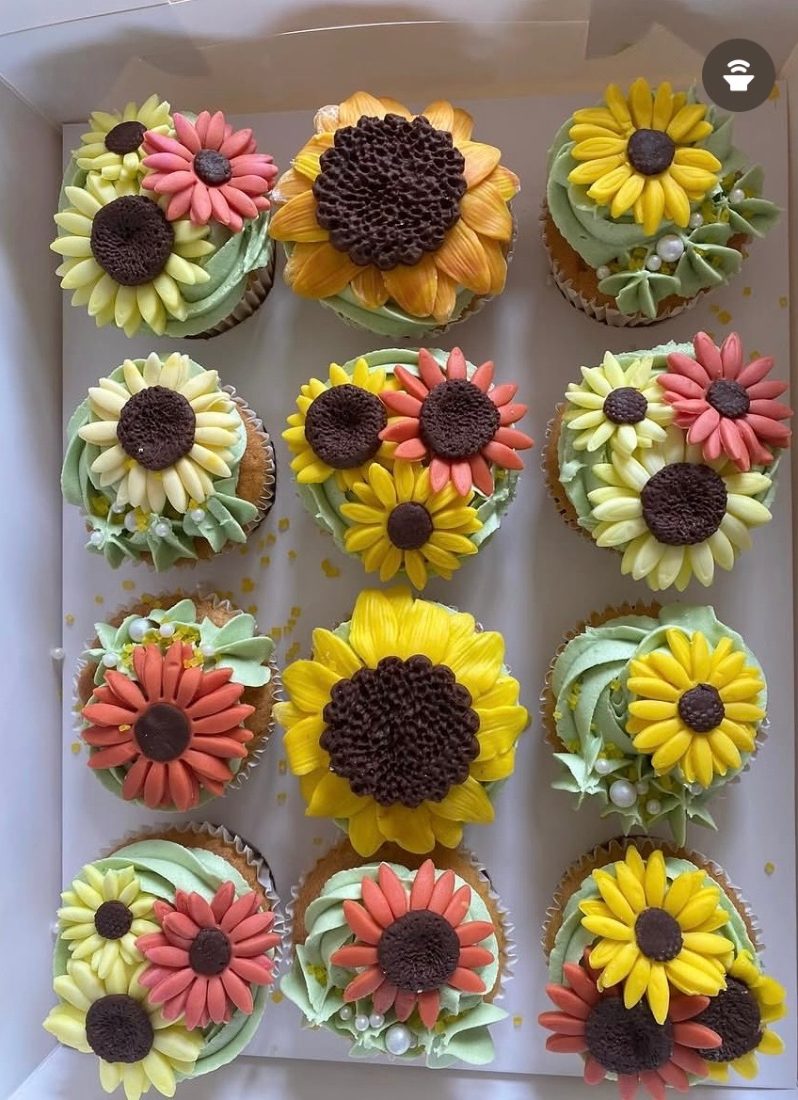 Box of twelve sunflower cupcakes in yellow and coral